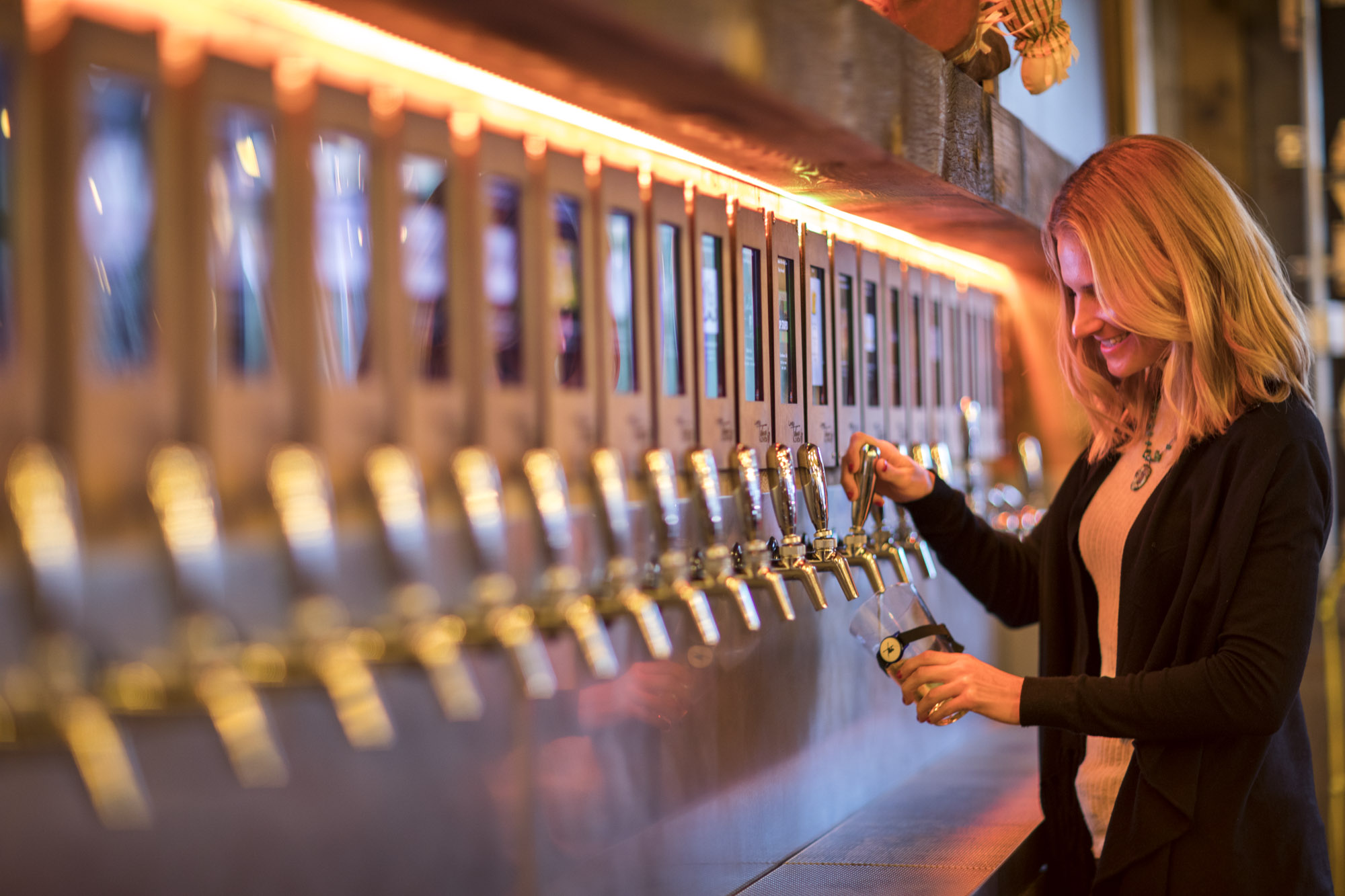woman tries an electronic beer tap