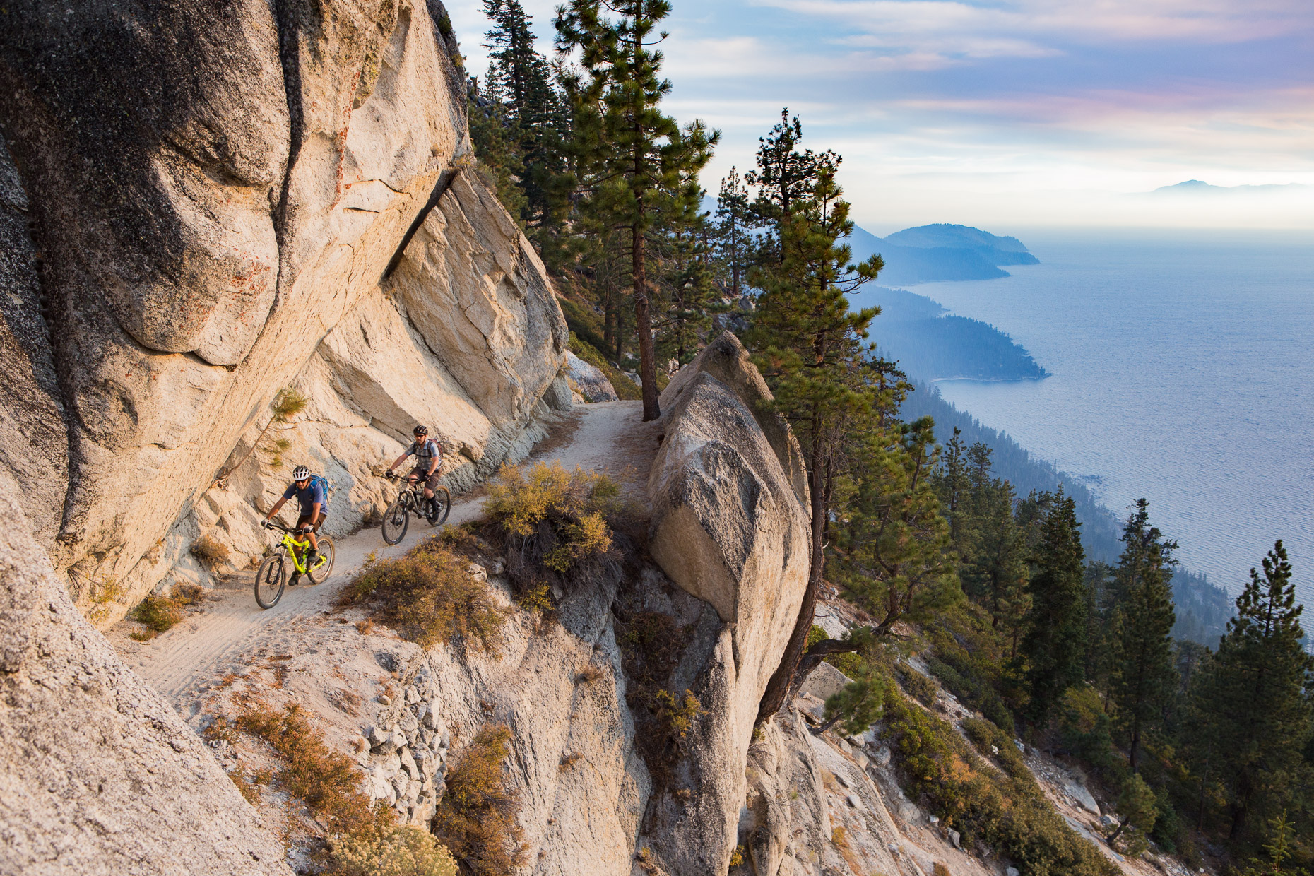 Mountain bikers brave the edge of the legendary Flume Trail at Lake Tahoe