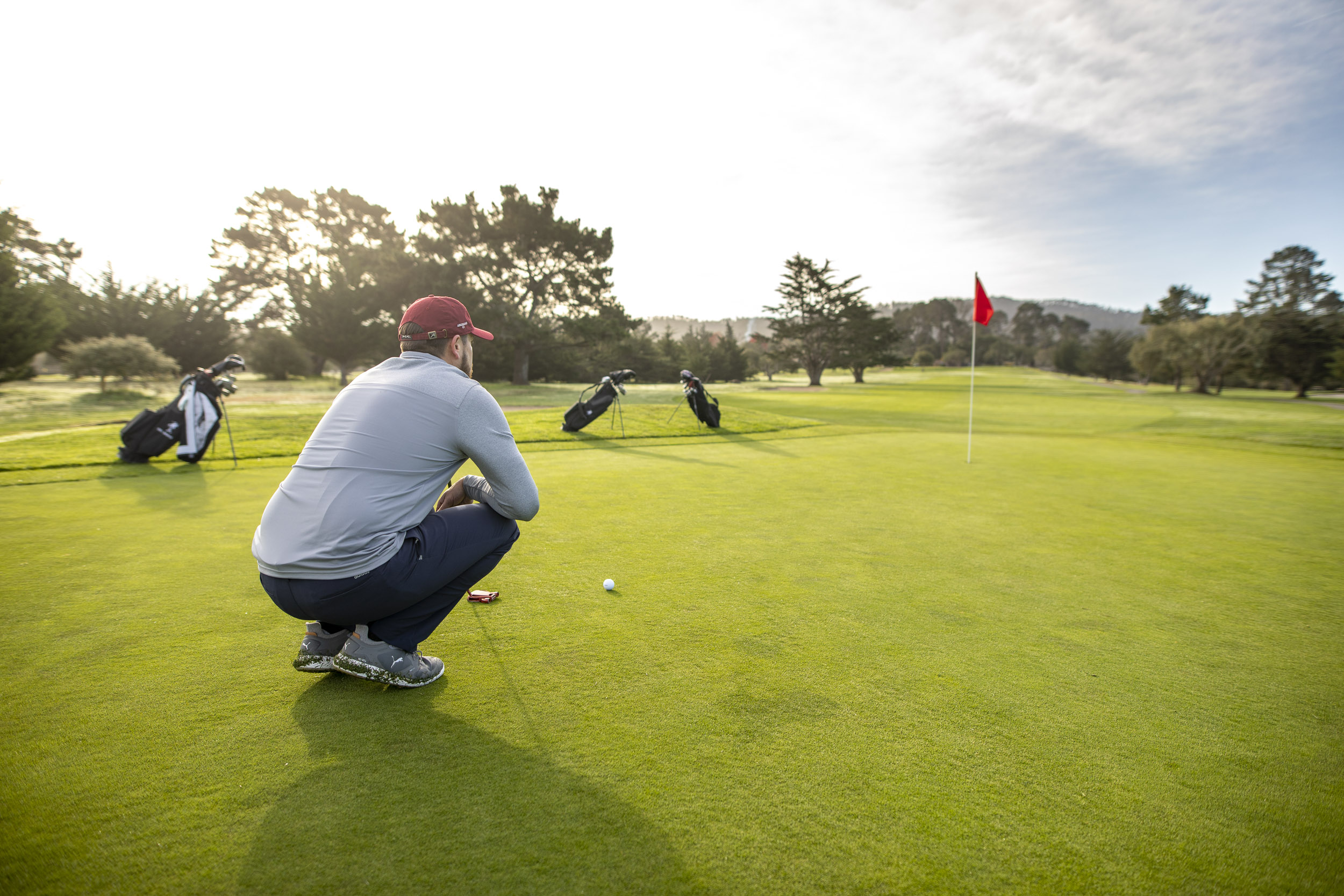 Man reads his putt at the Del Monte Golf Course