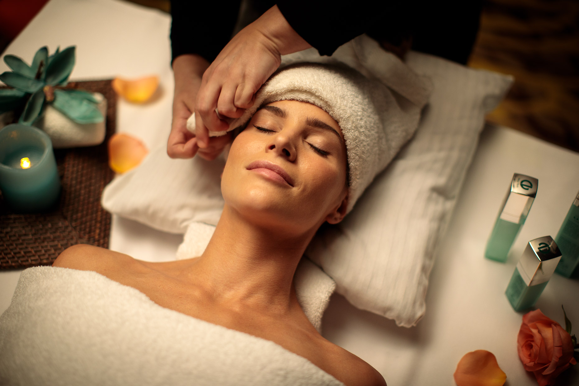 Woman receives a facial at a spa